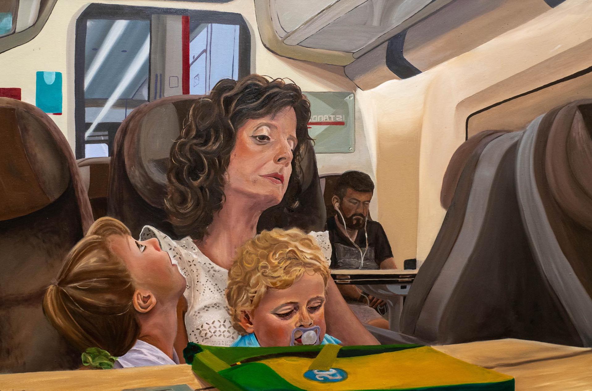 带孩子的女人在火车上画画