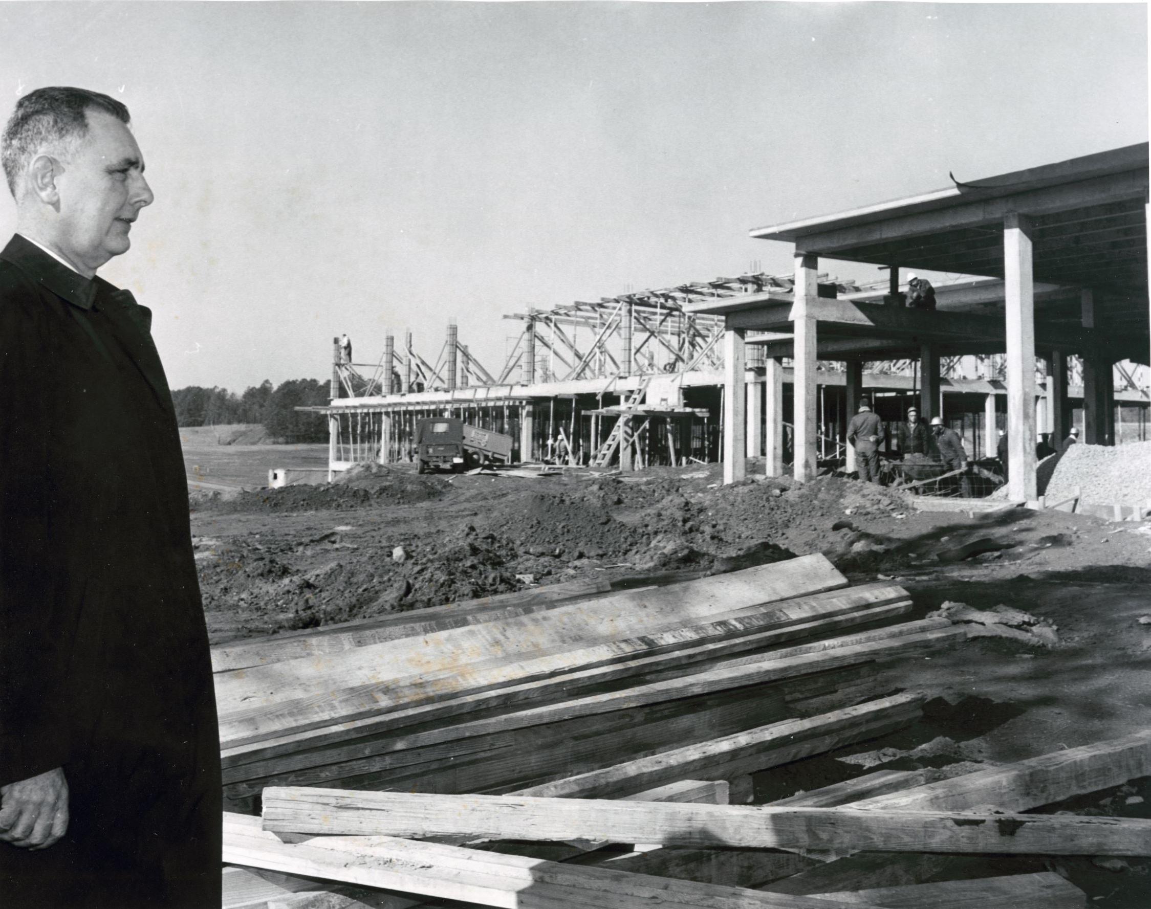 Howard Sturgis looking at library being built